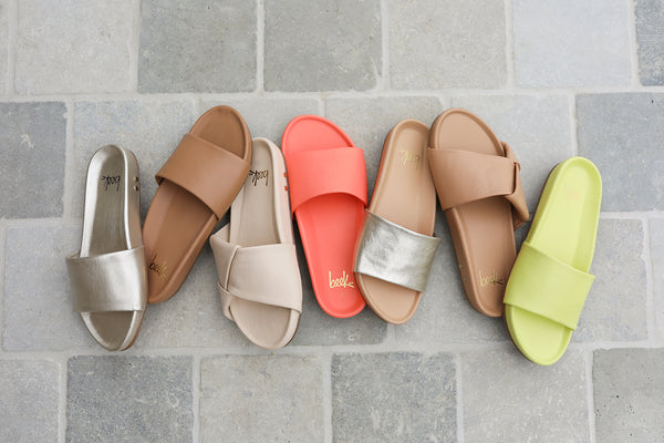 Gallito leather slide sandals in platinum, honey, coral, celery with Tori leather slide sandals in macadamia and beach