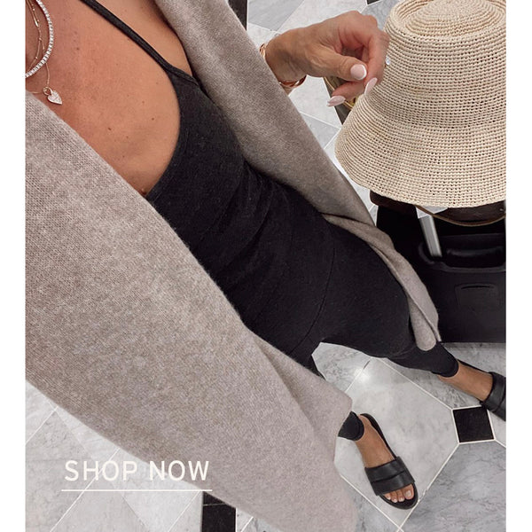 @itsybitsyindulgences in Sugarbird slide sandal in black with link to shop.