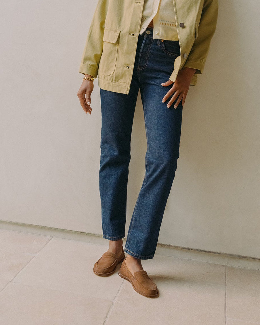 Woman wearing Griffin suede loafer in toffee with jeans