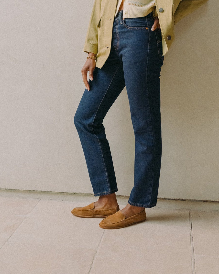 Woman wearing Griffin suede loafers in toffee with jeans and sweater