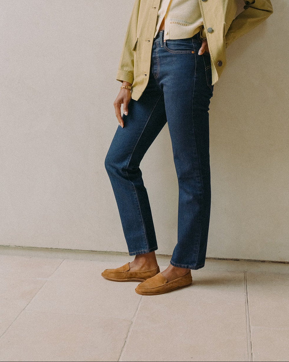 Woman wearing Griffin suede loafers in toffee with jeans and sweater and jacket