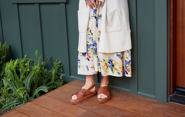 Woman wearing Gull leather platform sandal in cognac