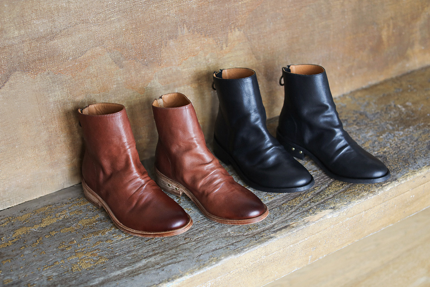Group shot of Hawk leather ankle boots in mahogany and black.