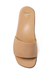 Honeybird leather slide sandals in beach - single shoe top shot
