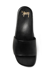 Honeybird leather slide sandals in black - single shoe top shot