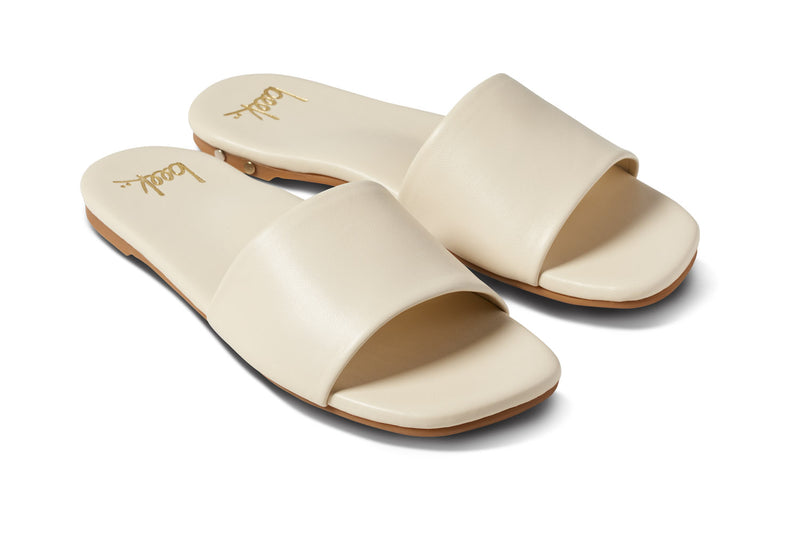 Honeybird leather slide sandals in eggshell - angle shot