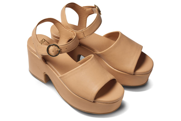 Inca leather platform heel sandals in beach - angle shot