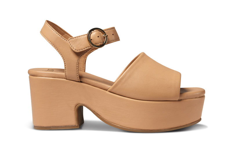 Inca leather platform heel sandals in beach - side shot