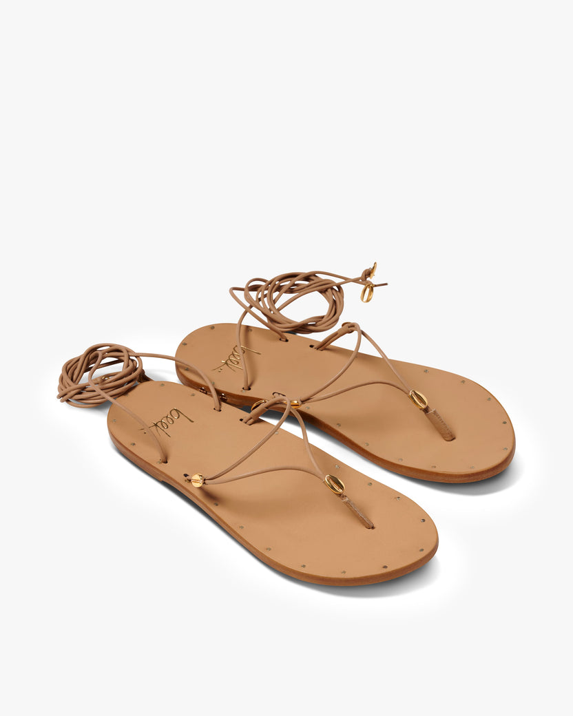 Koha leather ankle wrap sandal in beach - product angle shot