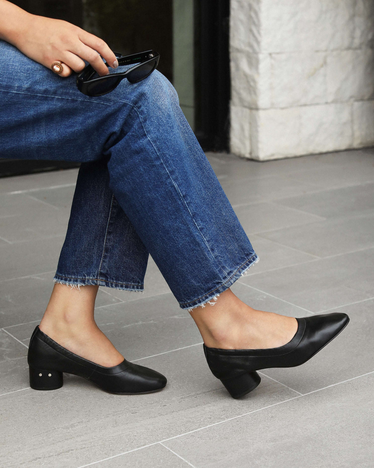 Woman wearing Lina leather ballet heels in black with jeans