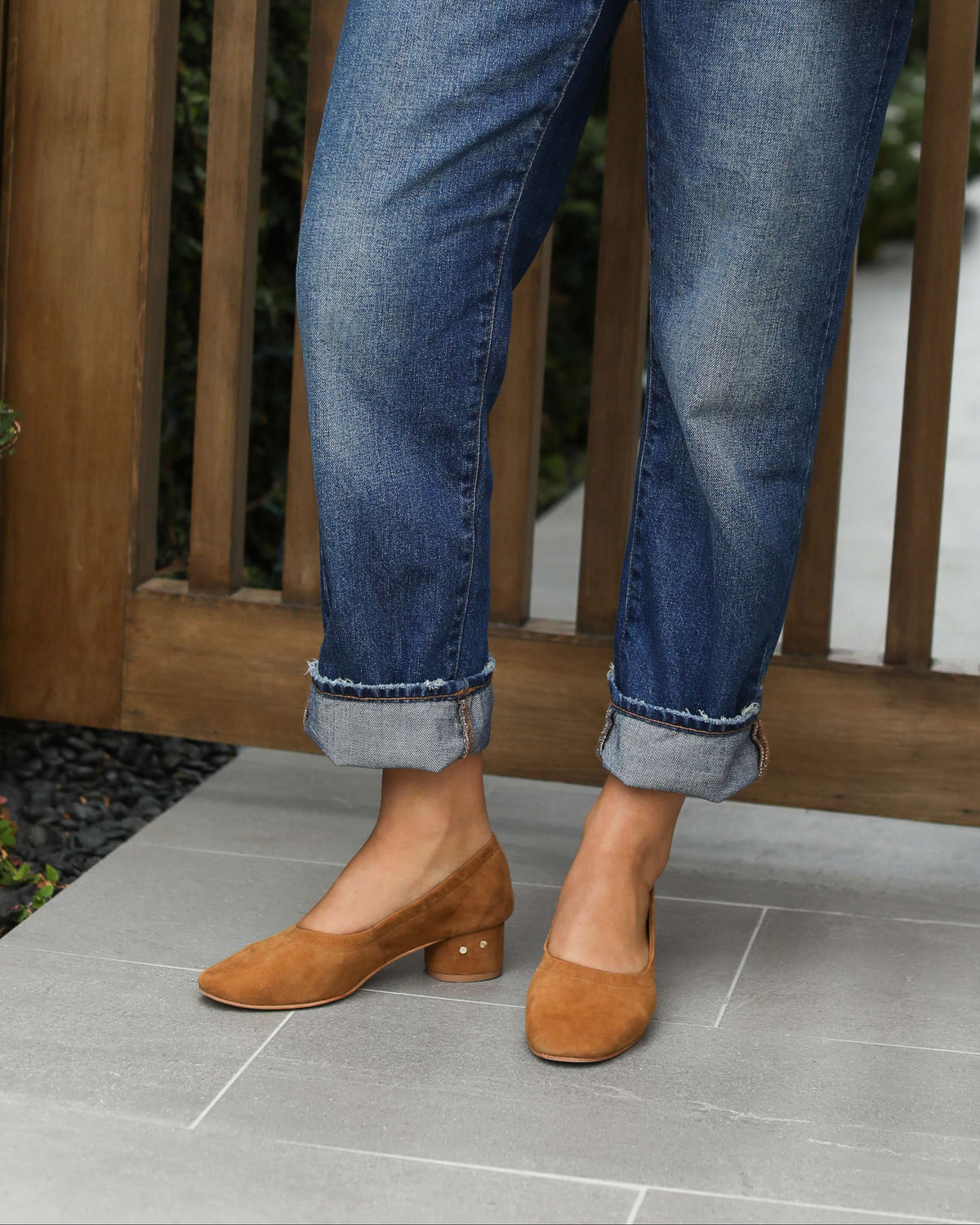 Woman wearing Lina suede ballet heels in toffee with jeans