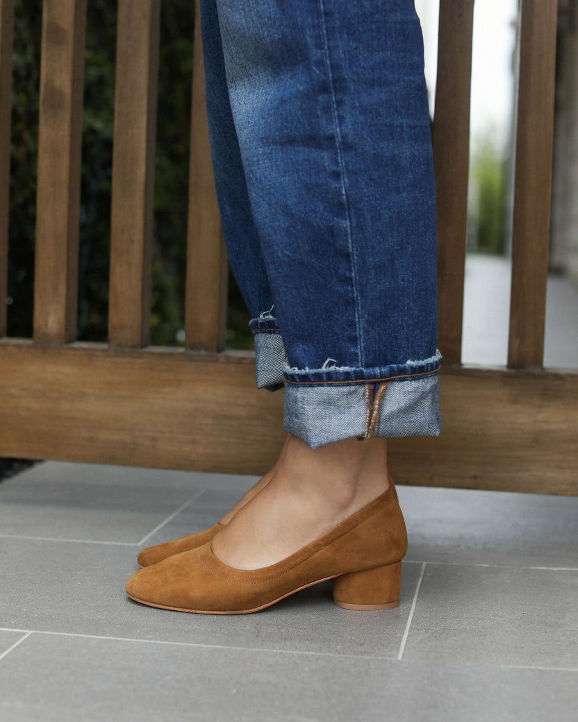 Woman wearing Lina suede ballet heels in toffee with jeans