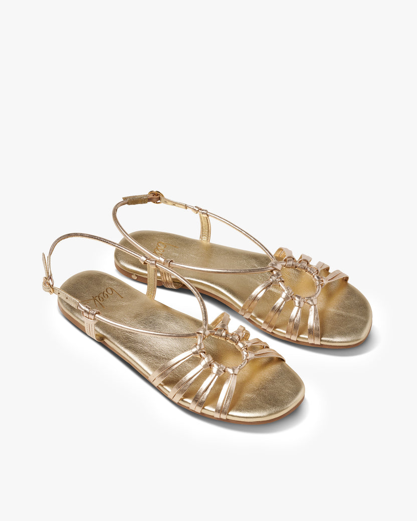 Livia leather ankle wrap sandal in gold - product angle shot