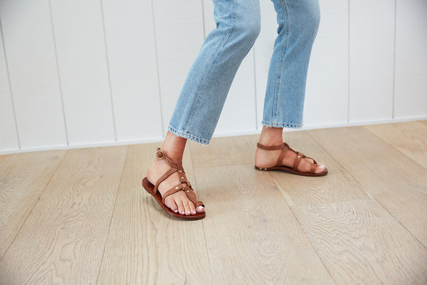 Woman wearing Miner leather studded sandals in tan