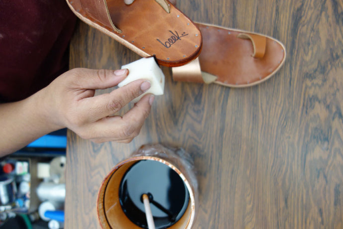 Photo of sandals being hand dyed
