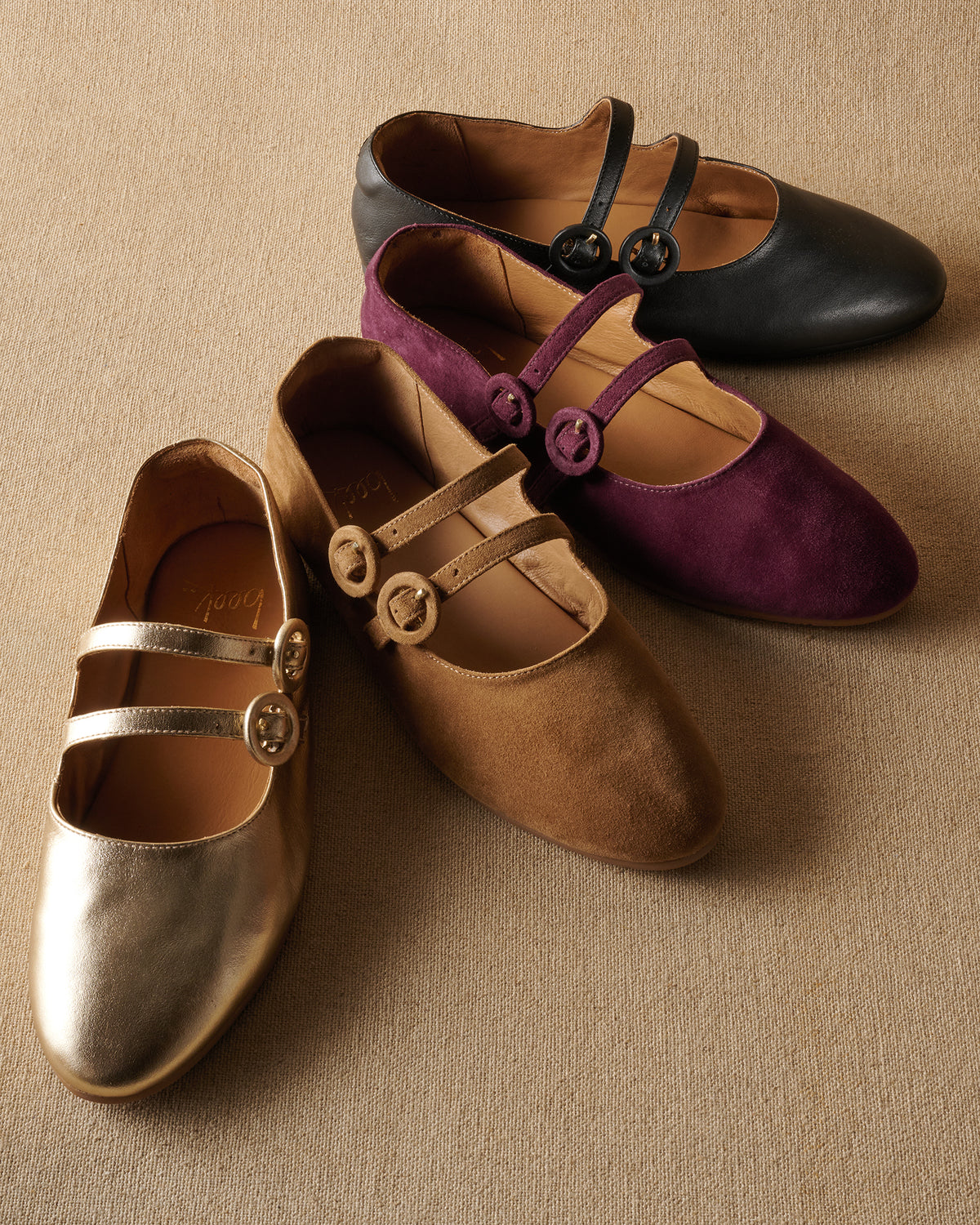 Group shot of Partridge mary jane ballet flats in gold leather, toffee suede, prune suede, black leather