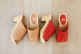 Group shot of Peacock clogs in red and honey