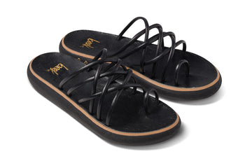 Peep leather slide sandal in black - angle shot