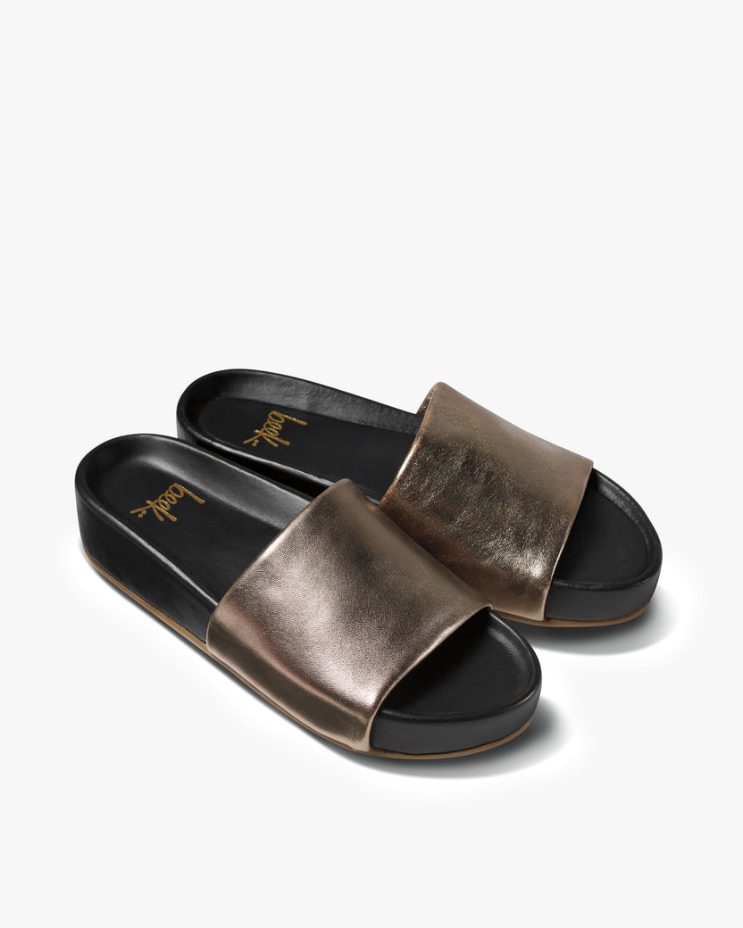 Pelican leather platform sandal in bronze/black - angle shot