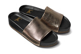 Pelican leather platform sandal in bronze/black - angle shot