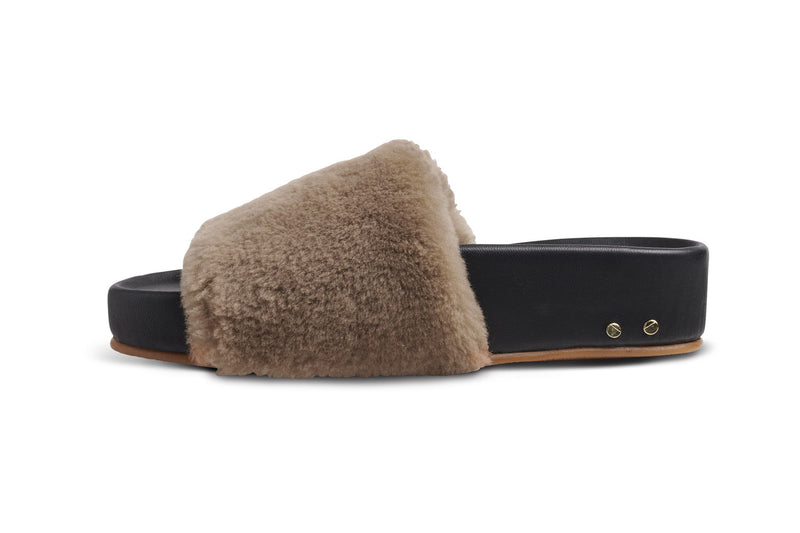 Pelican shearling sandal in bronze/black - side shot