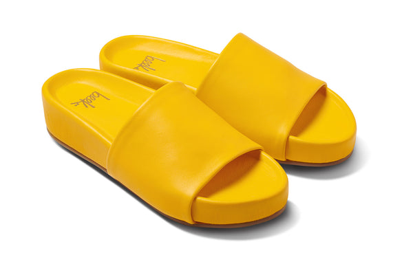 Pelican leather platform sandals in sunflower - angle shot