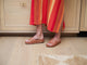 Woman wearing Pelican leather platform sandals in tan with striped dress