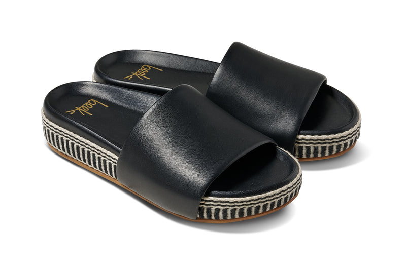 Pelican Textile wrapped leather platform sandal in black - product angle shot