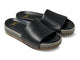 Pelican Textile wrapped leather platform sandal in black - product angle shot