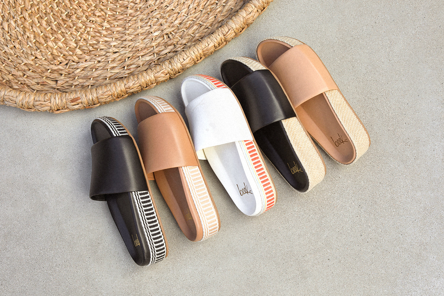 Group shot of Pelican Textile leather platform sandal in black, honey, and vanilla with Pelican Jute leather platform sandals in black and beach.
