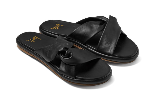 Piculet twisted leather slide sandals in black - angle shot