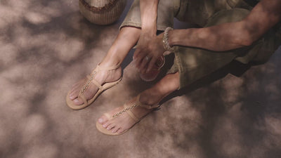 Video of woman wearing Goldenbird leather beaded ankle-strap sandal in beach