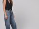 @jenhawkins wearing Puffin leather booties in black with barrel leg jeans 