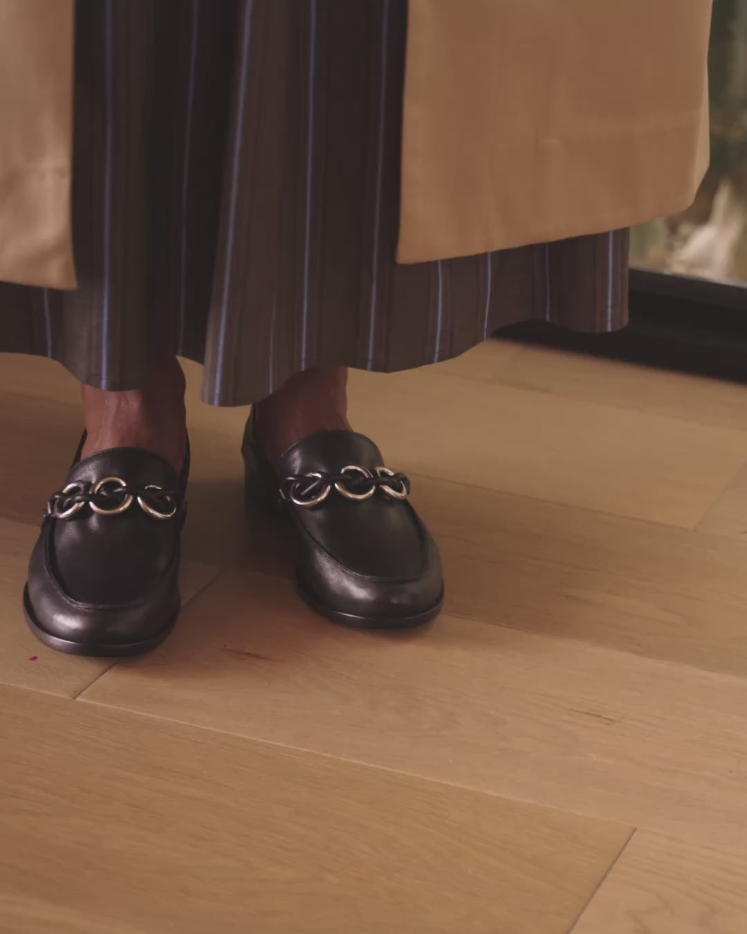 Video of woman wearing Prion leather loafers in black