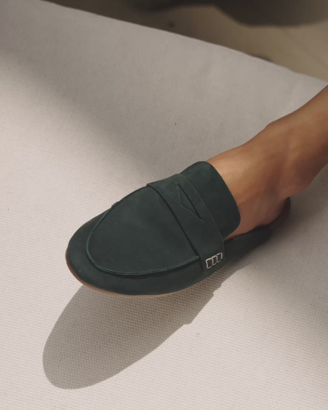 Video of woman wearing Mallard suede loafer mule in teal