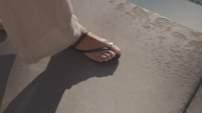 Video of woman wearing Starbird leather studded toe-ring sandal in black 