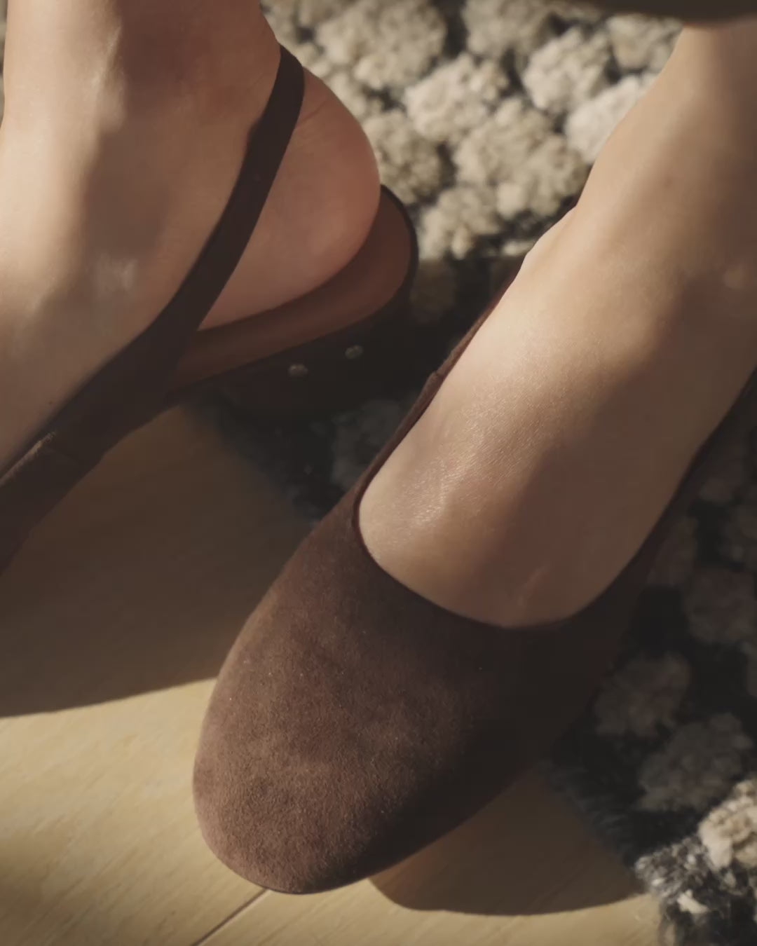 Video of woman wearing Lora suede heeled sling back shoes in chocolate 