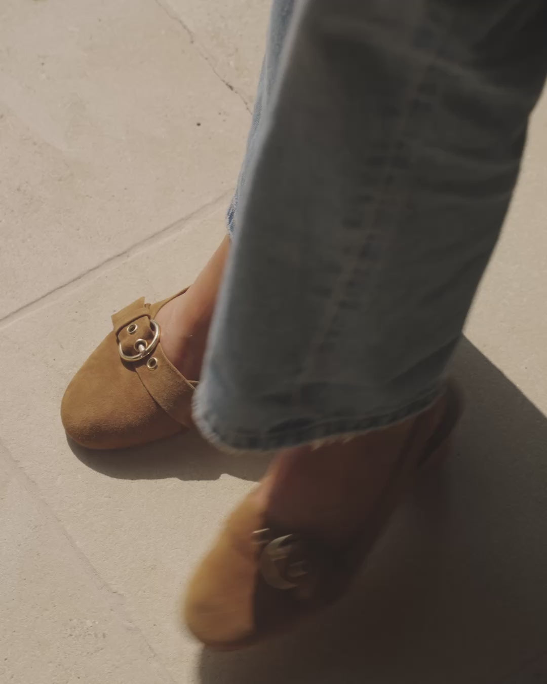 Video of woman wearing Rhea suede slingback heels in caramel with jeans, walking
