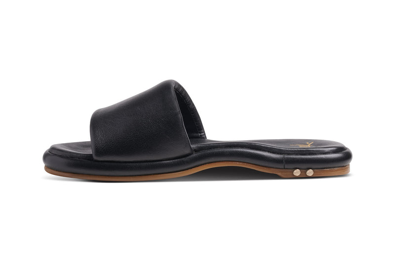 Puffbird leather slide sandal in black - side shot
