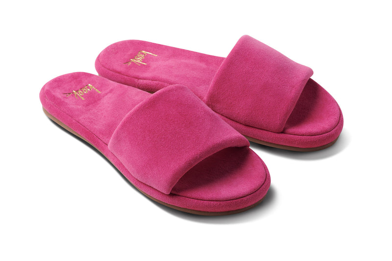 Puffbird suede slide sandal in fuchsia - angle shot