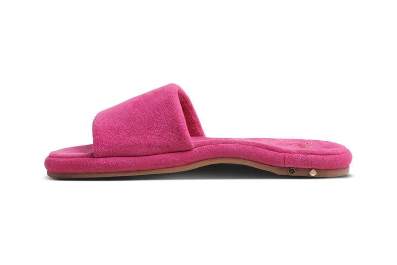 Puffbird suede slide sandal in fuchsia - side shot