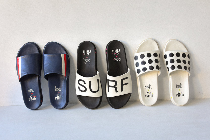 Group shot of Railibird leather slide sandals in stripe, surf, and dot against the wall