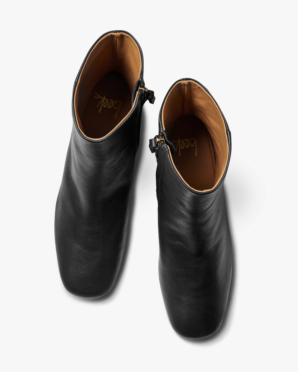 Raven leather heeled boots in black - product top shot