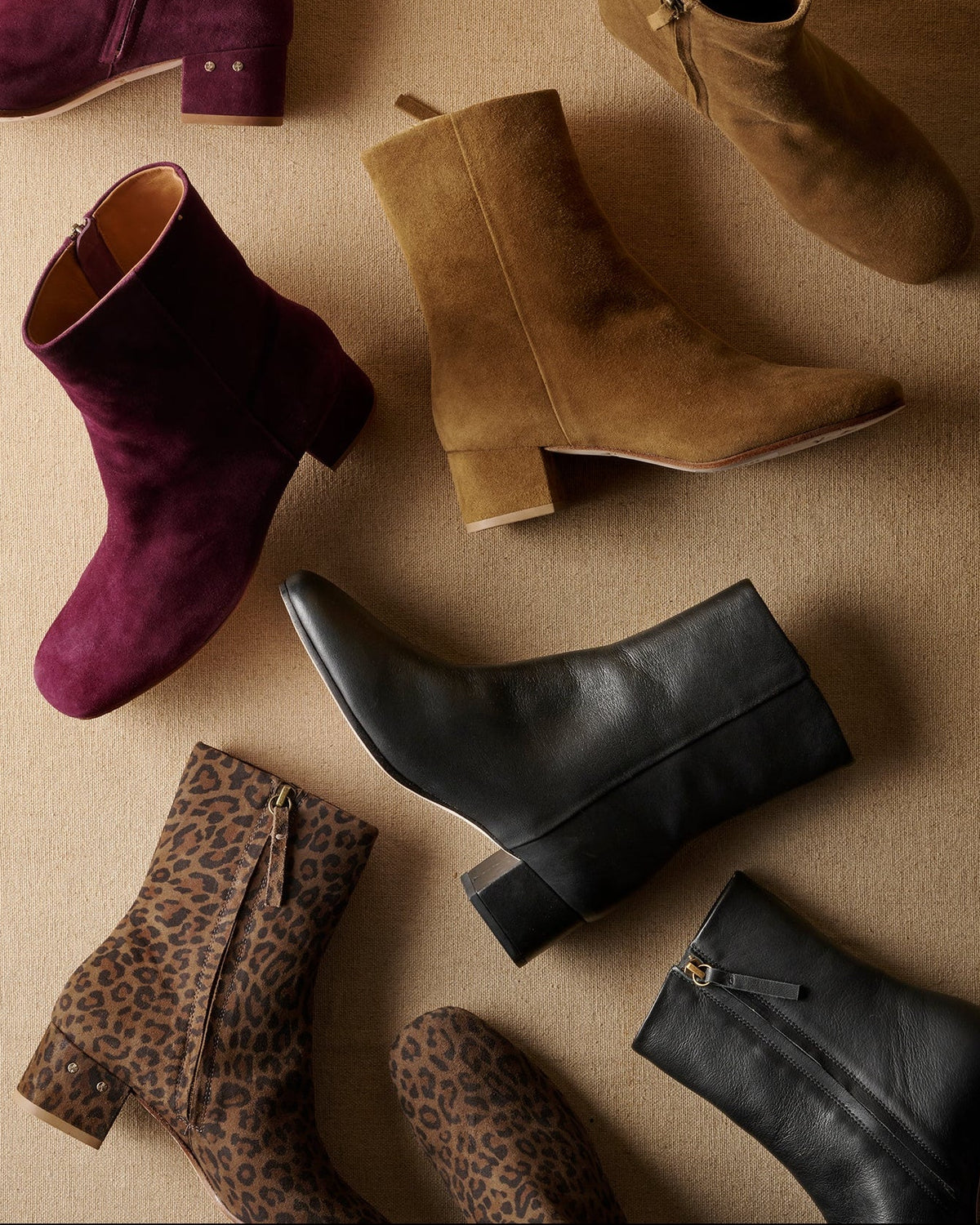 Group shot of Raven leather and suede boots in prune, toffee, black, leopard colors