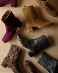 Group shot of Raven leather and suede boots in prune, toffee, black, leopard colors