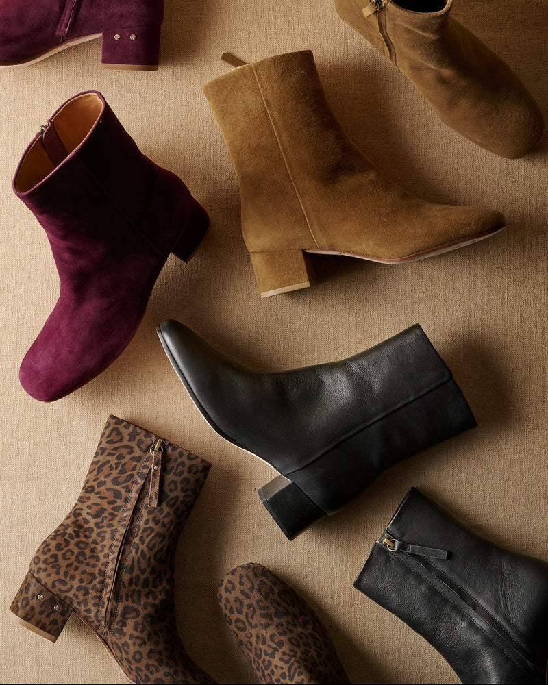 Group shot of Raven leather and suede boots in prune, toffee, black, leopard colors