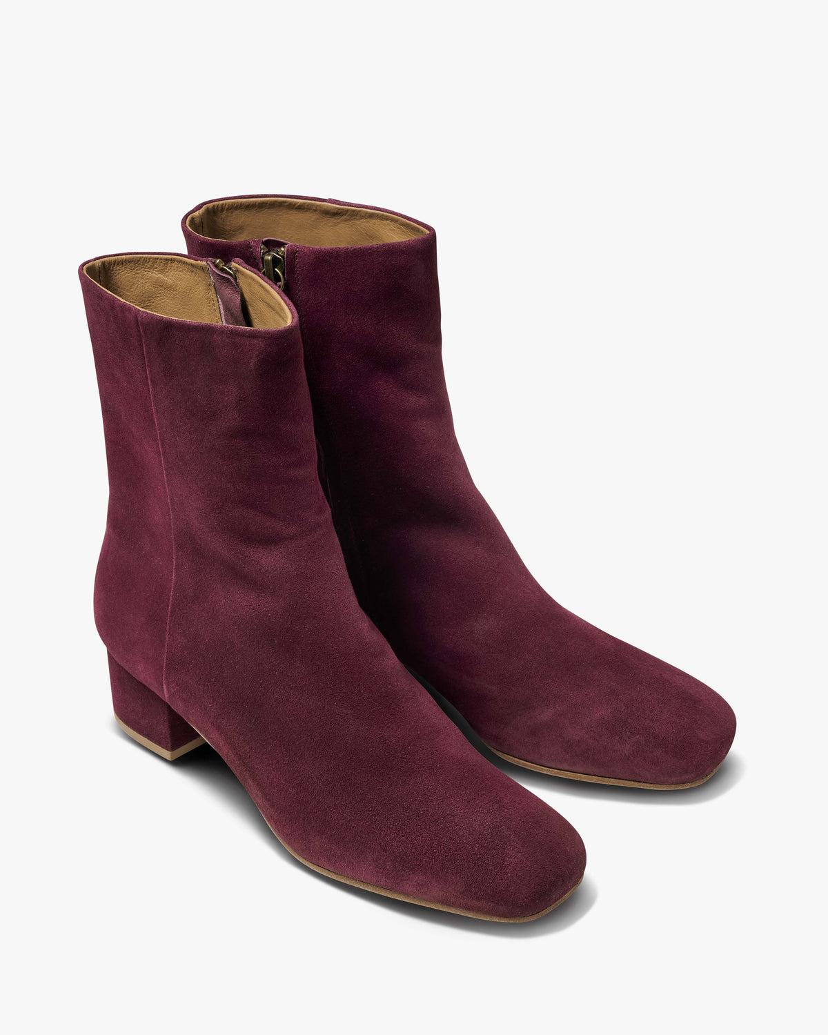 Raven suede heeled boots in prune - product angle shot