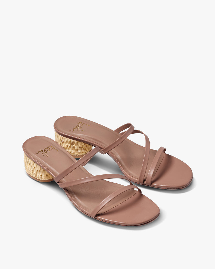 Roselle leather sandal with raffia heel in beach - product angle shot