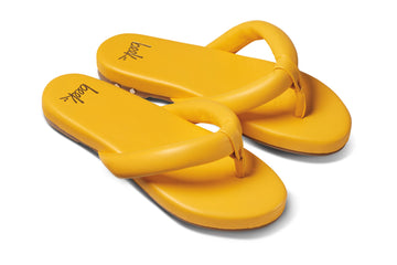 Ruby leather flip flop sandals in sunflower - angle shot