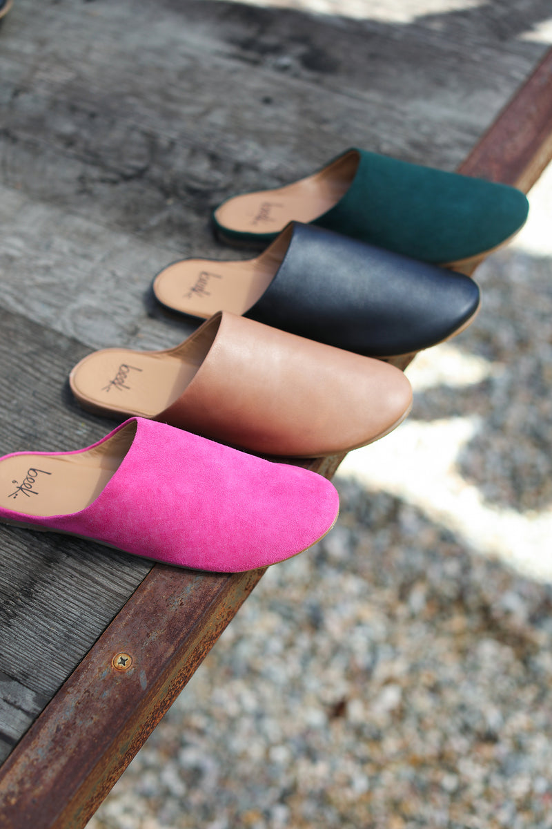Sanderling mules in fuchsia suede, saddle leather, black leather, forest suede colors.